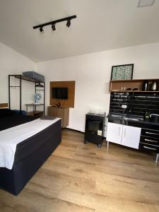 Ένα ή περισσότερα κρεβάτια σε δωμάτιο στο Loft Santos dumont