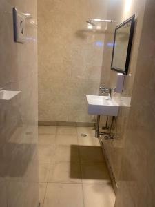 a bathroom with a sink and a mirror at Ashu Villa in New Delhi +27 photos