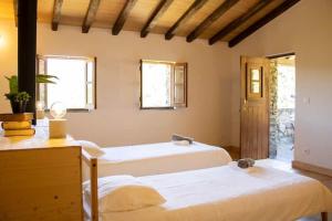 En eller flere senge i et værelse på Telhados de Xisto