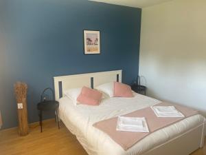 Postel nebo postele na pokoji v ubytování Le Vrai Paradis