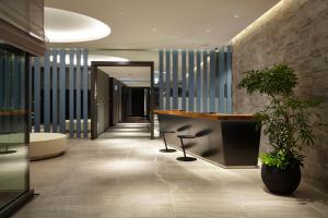a lobby with a reception desk in a building at Futakotamagawa Excel Hotel Tokyu in Tokyo