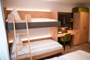 a room with two bunk beds and a desk at Gasthaus Stroh in Buchholz +65 photos