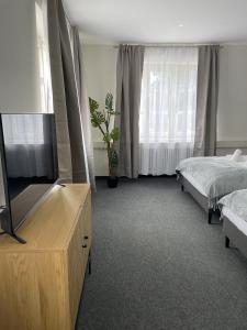 TV a/nebo společenská místnost v ubytování Hossi-Rathaus
