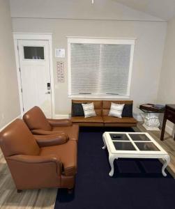a living room with a couch and a coffee table at Delightful 3-bedroom house in Bradenton #2 of 2 in Bradenton +29 photos