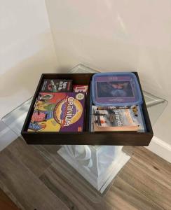 a shelf with a box of games on it at Delightful 3-bedroom house in Bradenton #2 of 2 in Bradenton