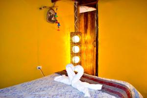 Postel nebo postele na pokoji v ubytování Salkantay Hostel Chaullay