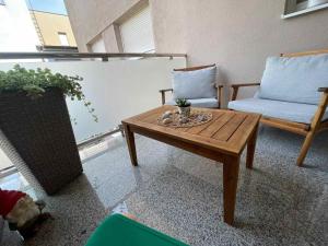 a living room with a coffee table and a couch at Remi in Slavonski Brod