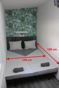 Posteľ alebo postele v izbe v ubytovaní Tutti Apartman 2