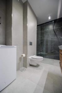 Ένα μπάνιο στο Apartamenty Mazurska Strefa