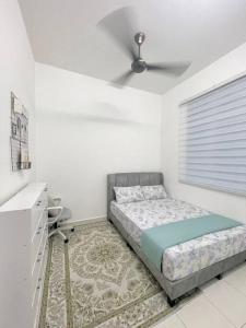 Postel nebo postele na pokoji v ubytování NN Homestay Anjung Gapam Ayer Keroh + 7 fotografií