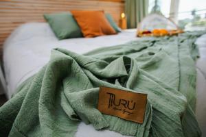Uru Apart Iguazu客房内的一张或多张床位