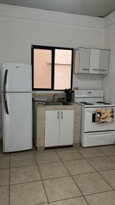 Kuchyň nebo kuchyňský kout v ubytování Apartamentos Trebol