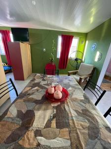 a dining room table with a red plate on it at departamento nicolay in Junín