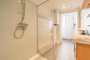 a bathroom with a shower and a sink at Centre - Parking - Cathédrale in Reims +17 photos