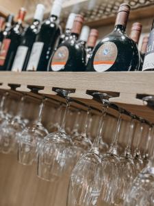 a bunch of wine glasses sitting on a shelf at Bayerischer Hof Spalt in Spalt