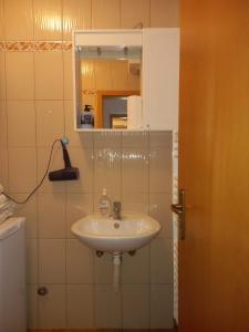 a bathroom with a sink and a mirror at Klara in Tomislavgrad