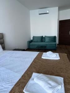 Hotel Sutomore客房内的一张或多张床位