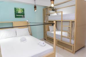 Postel nebo postele na pokoji v ubytování Hostal Las Guaduas + 37 fotografií