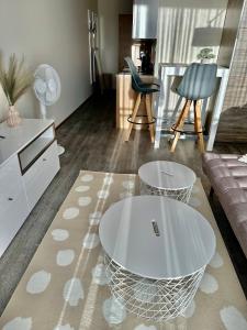 a living room with a table and a couch at Aisa 39 in Pärnu