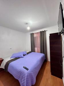 Ένα ή περισσότερα κρεβάτια σε δωμάτιο στο Hostal la Plaza