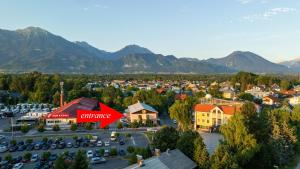 an aerial view of a small town with mountains at Rooms Bella in Bled
