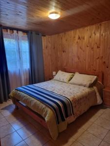 Postel nebo postele na pokoji v ubytování Cabañas Soelafquen + 25 fotografií