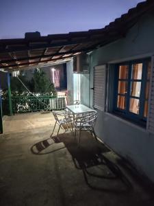 a table and two chairs sitting on a patio at Relaxhouse in Himare