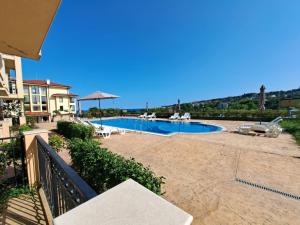 a swimming pool in the middle of a house at Sunny holidays in Byala