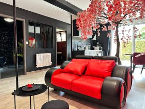 Posedenie v ubytovaní Suite Jeux d’Amour Jacuzzi / Love Room
