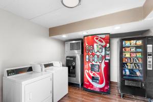 a coca cola machine and a soda machine at Red Roof Inn Indianapolis North - College Park in Indianapolis