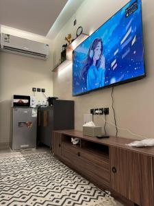 TV a/nebo společenská místnost v ubytování ريح بالك تسجيل ذاتي + 2 fotografie