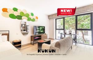 a living room with a bed and a tv at Kukun Reforma & Downtown in Mexico City