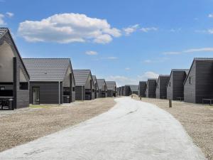a road leading to a row of houses at 8 person holiday home in Rømø in Kongsmark