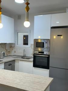 Η κουζίνα ή μικρή κουζίνα στο Palmara Las Canteras alquiler por habitación