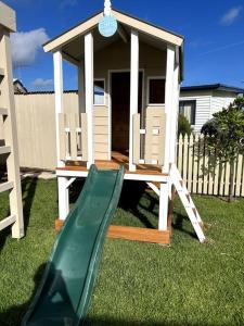 a playground with a slide and a gazebo at Rose Villa - Port Willunga in Port Willunga +32 photos