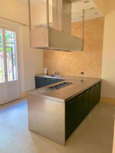 a kitchen with a stove and a counter top at la villa dell'orologio in Santa Croce sullʼ Arno +24 photos