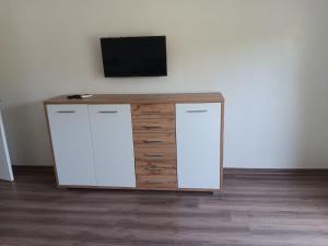 a desk with a television on top of it at Villa Jamel Marrakech Zac in Marrakesh