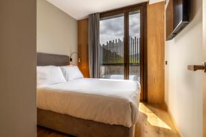 Postel nebo postele na pokoji v ubytování Un diamante de montaña l A Pie De Pistas De Esquí - Gimnasio - Sauna - Piscina l 6Pax l by BonesVacances