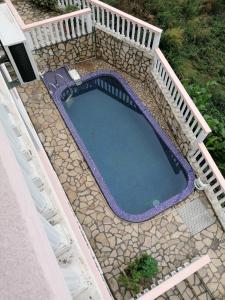 an overhead view of a swimming pool with a wooden deck at Villa Delfin 4 in Bar