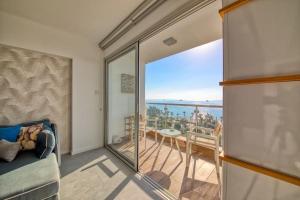 a living room with a view of the ocean at Limassol Molos Hawaii Royal - Front-line 2 bedroom in Limassol