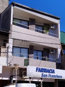 a building with a sign in front of it at Departamentos M&A 2 in Puerto Rico