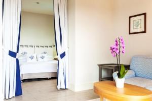 A bed or beds in a room at Hotel Villa Margherita