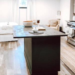 a kitchen with a large island in a living room at Cellar Suite at Winery and Vineyard in Waterford +12 photos