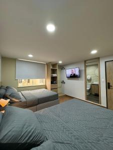 TV in/ali zabaviščno središče v nastanitvi Hostelfc Usaquen
