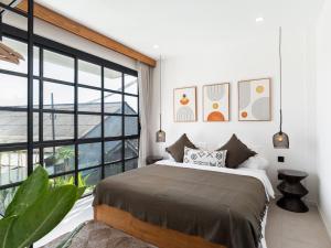 Ένα ή περισσότερα κρεβάτια σε δωμάτιο στο Tribeca Penthouse Canggu