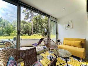a living room with a yellow couch and chairs at Studio lumineux proche plage, bois, marché - 4 pers, parking, animaux acceptés - FR-1-245-207 in Le Pouliguen