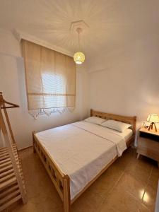 a bedroom with a bed and a window at Wonderful Sunset 1 in Bodrum City