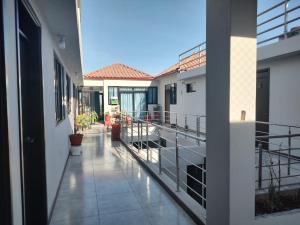 a balcony of a house with potted plants on it at Hoteles Villa Guadalupe in Majes +6 photos