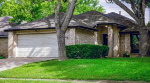 a house with a tree and a garage at Cozy, Round Rock Retreat, Modern, Sleeps 10 in Round Rock