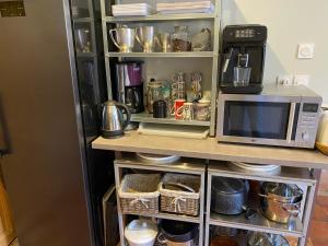 Cuisine ou kitchenette dans l'établissement COUNTRY HOUSE La VILLAE